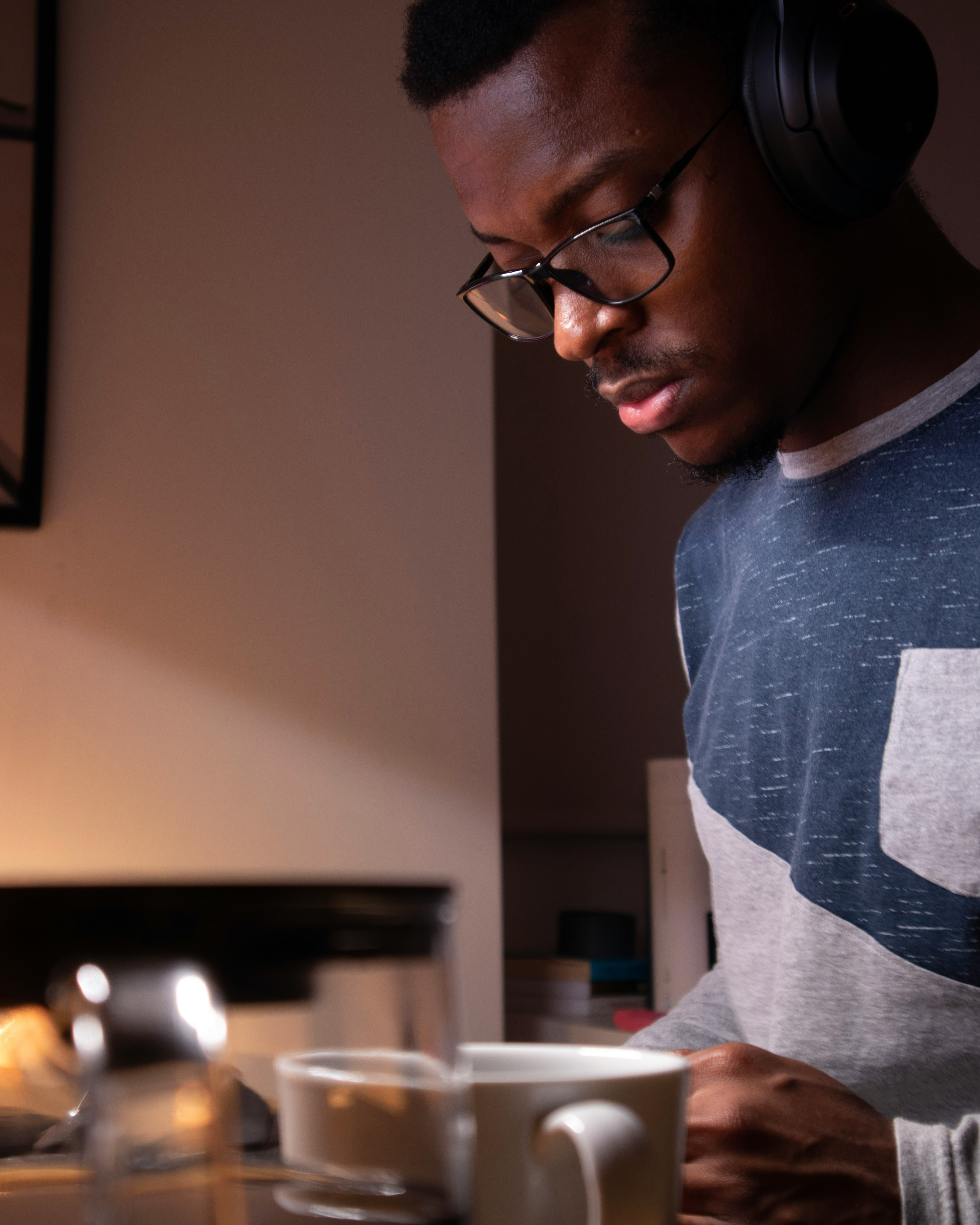 man in gray crew neck shirt wearing black framed eyeglasses